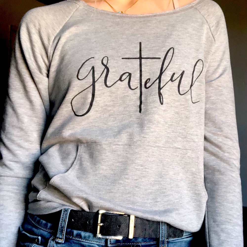 Grey pocketed sweater.